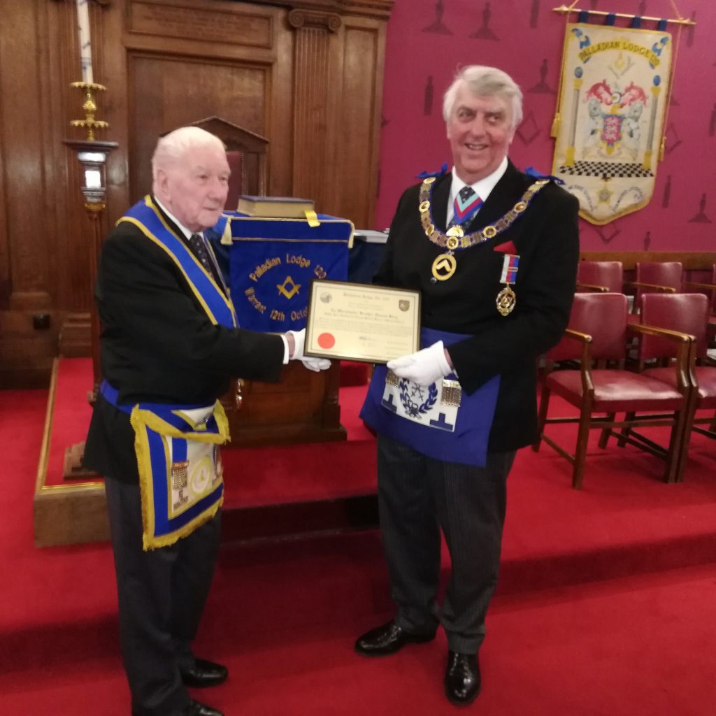 Bill receives his 50 year certificate from DPGM VW Bro Graham King