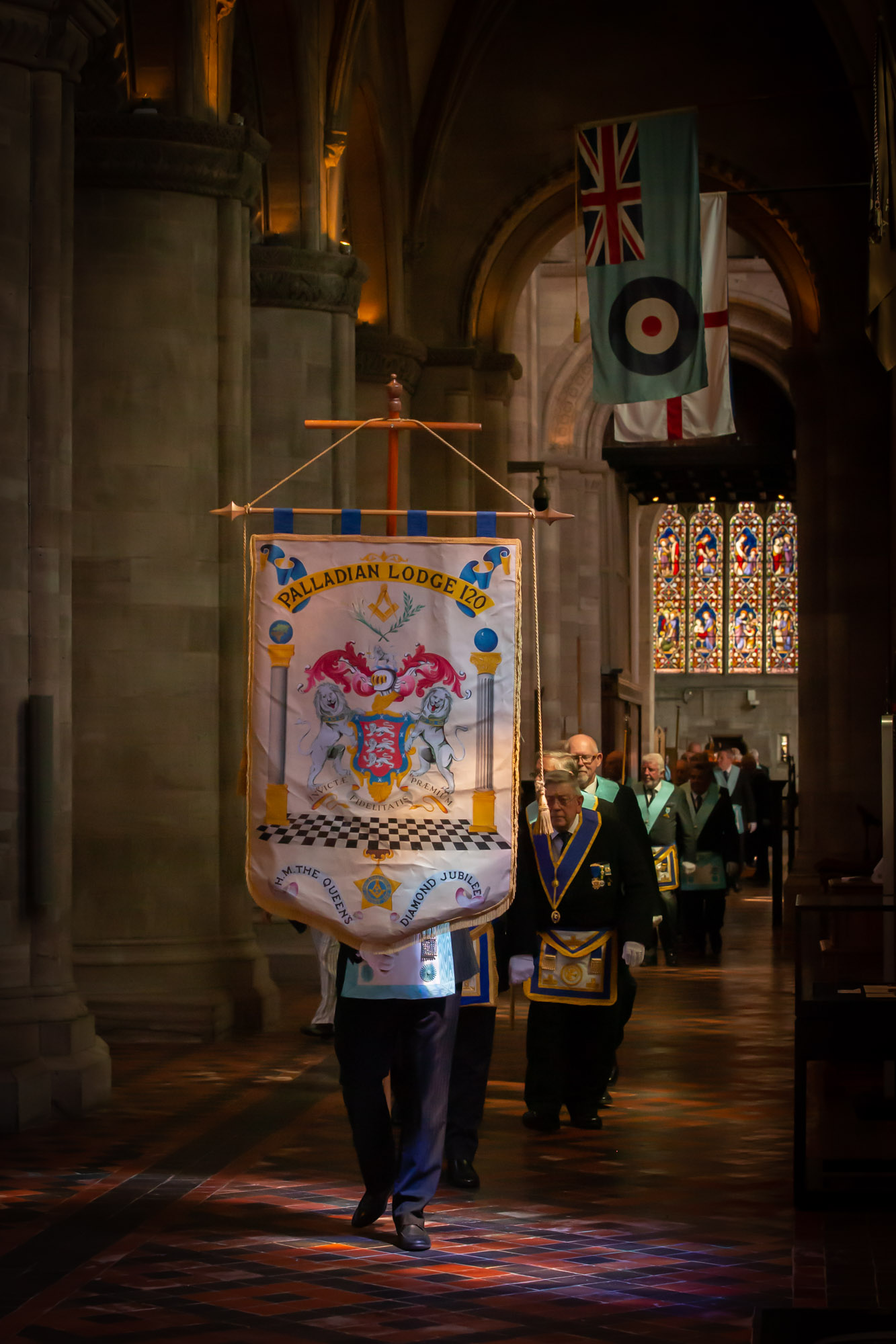 The Standard Bearer of Palladian Lodge leading the procession into the Cathedral service