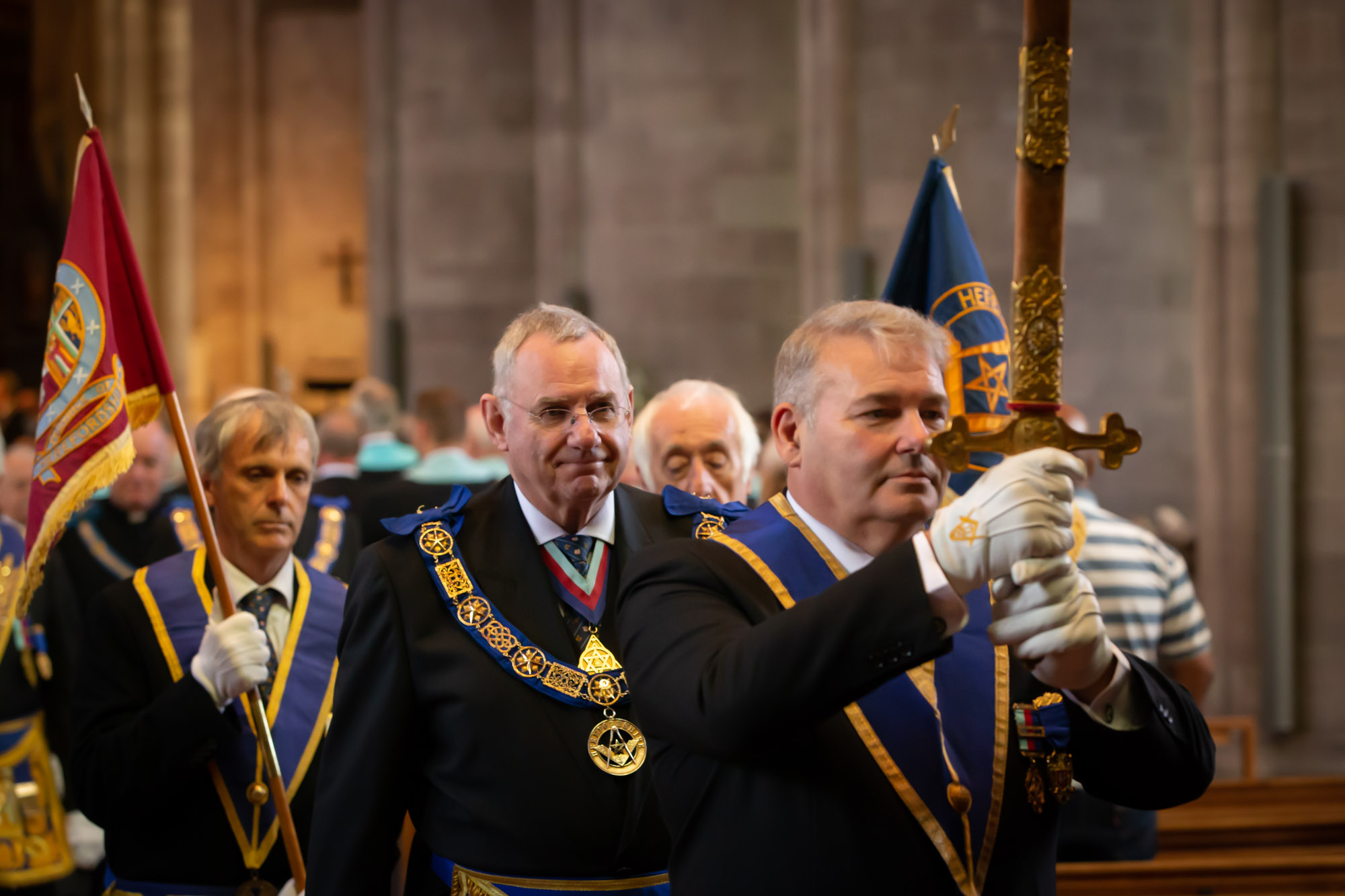 The Provincial Grand Master for Herefordshire RW Bro Michael Holland being lead out of the Cathedral service by the Grand Sword Bearer W Bro Johnny Walker.